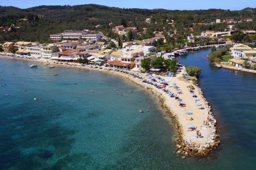 an aerial view of a beach with people in the water at Costas apartments in Mesongi