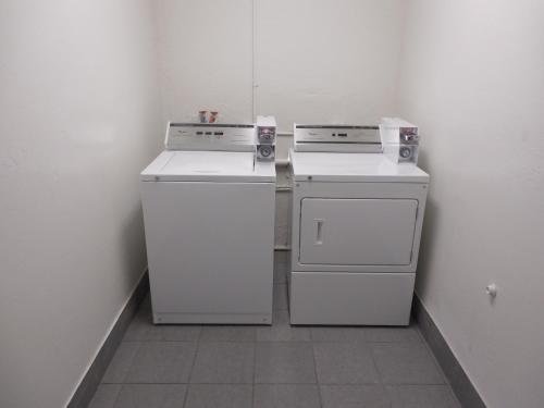 two white appliances are sitting in a room at Motel 6-Oklahoma City, OK - Bricktown in Oklahoma City