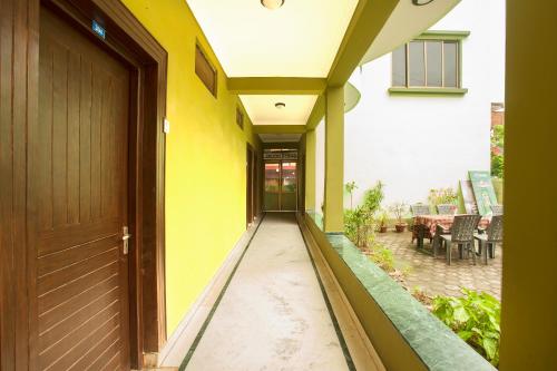 an empty hallway of a house with a door at Lumbini Guest House in Lumbini