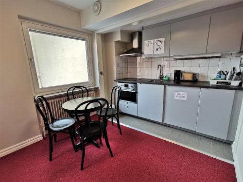 Kuchyň nebo kuchyňský kout v ubytování 2Home Hotel Gävle