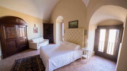 Ένα ή περισσότερα κρεβάτια σε δωμάτιο στο Palazzo Viceconte