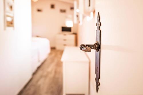 a close up of a door with a metal handle at Agroturismo Finca Sa Tanca in Cala d´Or