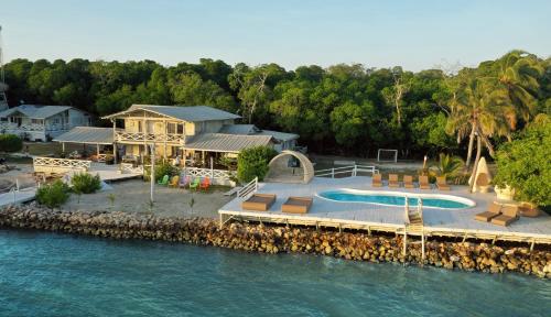 an aerial view of a house next to the water at Quinta del Mar Sunset in Isla Mucura