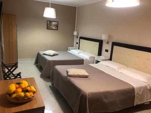Postel nebo postele na pokoji v ubytování Hotel Di Stefano