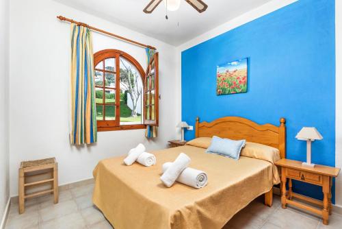 En eller flere senge i et værelse på Apartamento Els Girasols