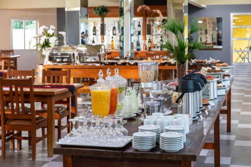 En restaurant eller et andet spisested på Canzi Cataratas Hotel