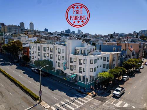 a large white building with a free parking sign on it at Buena Vista Motor Inn in San Francisco