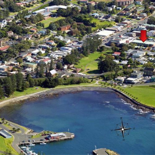 an aerial view of a lake with a windmill at Kiama Shores in Kiama