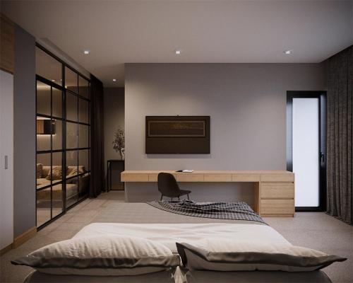a bedroom with a large bed and a desk at Fukurai Hotel & Apartment 2 Ha Noi in Hanoi