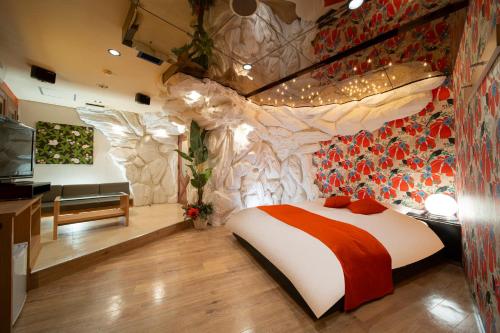 Giường trong phòng chung tại Royal Hotel Uohachi Bettei