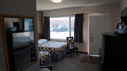 Кровать или кровати в номере Caravel Motel