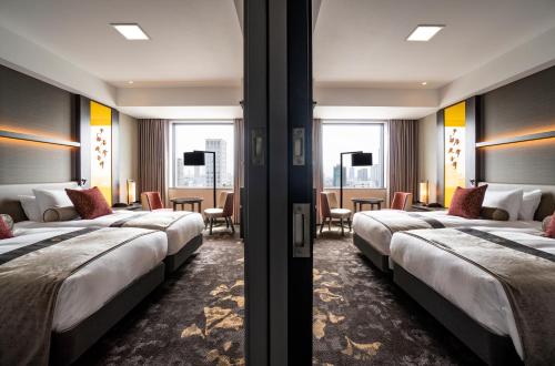 Letto o letti in una camera di The Royal Park Hotel Iconic Osaka Midosuji