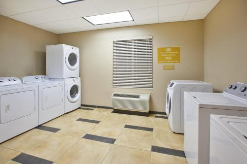 a laundry room with washing machines and a window at Candlewood Suites Morgantown-Univ West Virginia by IHG in Morgantown