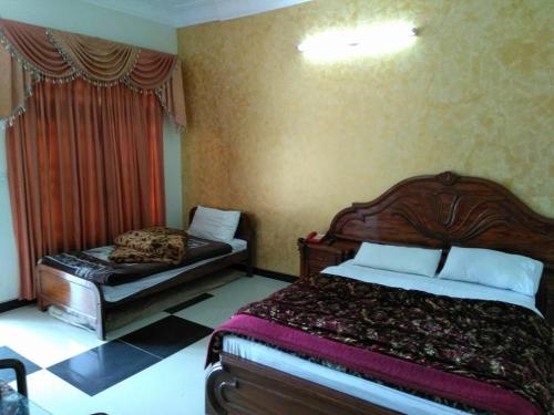 Llit o llits en una habitació de Hotel Hill City Mingora Swat