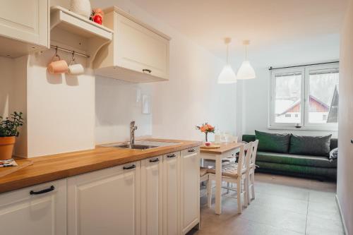 Kuchyň nebo kuchyňský kout v ubytování Apartment Via Mons