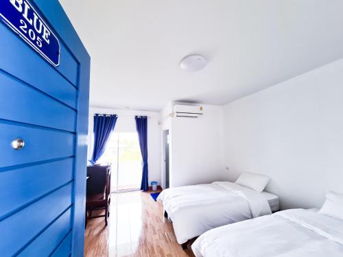 Katil atau katil-katil dalam bilik di Blue House