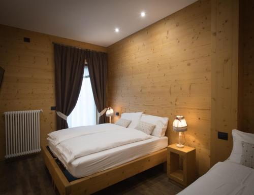 Ένα ή περισσότερα κρεβάτια σε δωμάτιο στο Chalet La Rugiada