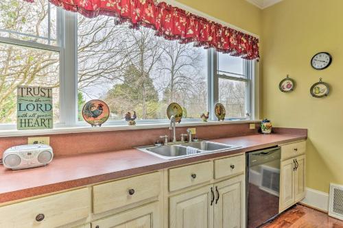 a kitchen with a sink and a window at Elegant and Spacious Retreat about 18 Mi to Lake Norman! in Lincolnton