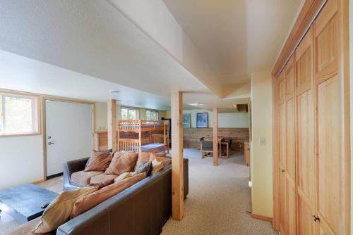 a living room with a couch and a bedroom at Sharlie's Nest by Casago McCall - Donerightmanagement in McCall