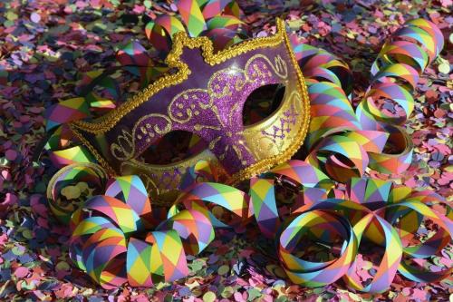 a purple mask and some colorful confetti at TimberCrest Downtown Lakeview Condo South by Casago McCall - Donerightmanagement in McCall