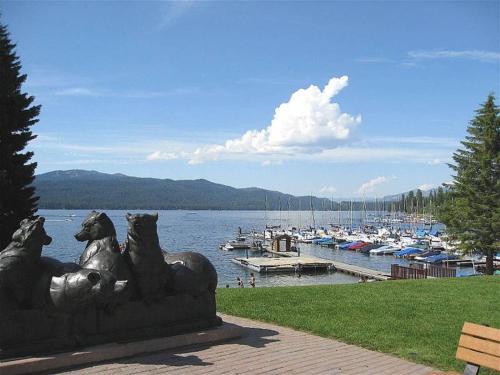 a statue of dogs at a marina with boats at TimberCrest Downtown Lakeview Condo North by Casago - Donerightmanagement in McCall