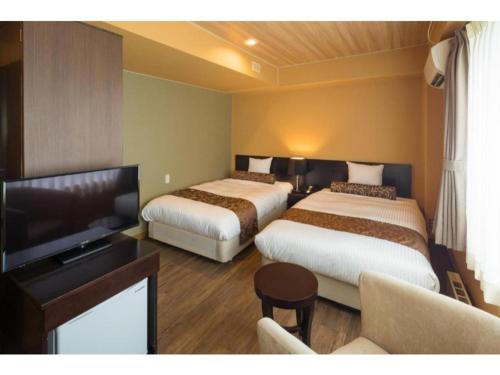 Tempat tidur dalam kamar di Tazawako Lake Resort & Onsen / Vacation STAY 78983