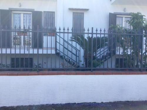 a wrought iron fence in front of a house at Maria's home in Pompei