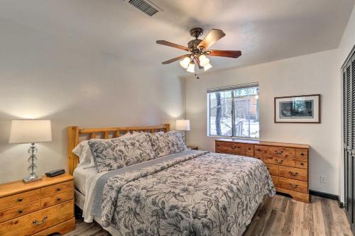 a bedroom with a bed and a ceiling fan at Rustic-Chic Prescott Cabin with Deck in Wooded Area! in Prescott