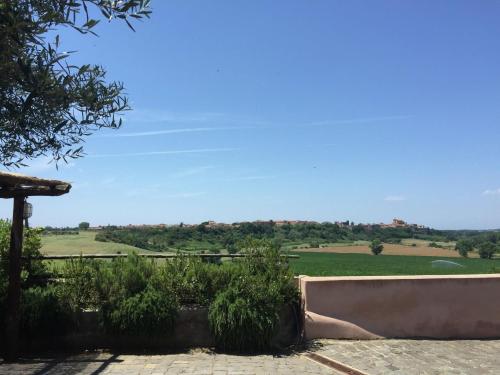 a view of a field from a house at Apartment in Montalto near Lake and Pool in Montalto di Castro