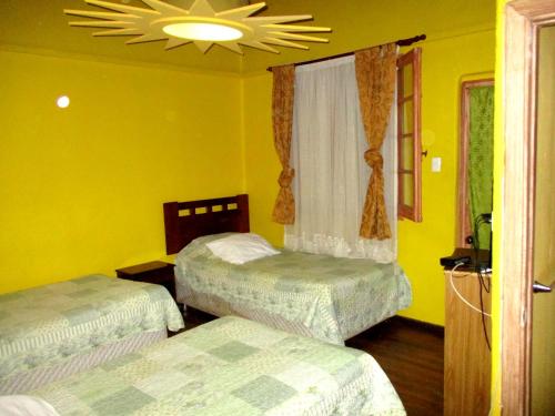 En eller flere senge i et værelse på Hotel Centro Sur - Colonial
