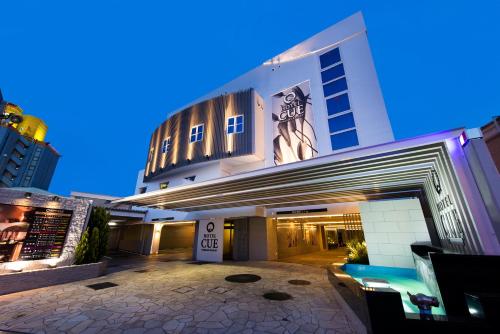a large white building with a lot of windows at Hotel CUE Machida(Adult Only) in Machida