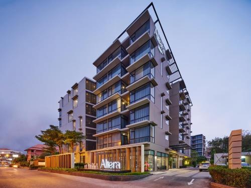 a rendering of an apartment building on a street at Altera Hotel and Residence by At Mind in Pattaya Central