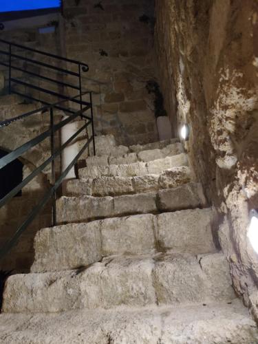 a set of stone stairs in a cave at Porolithos Boutique Hotel in Rhodes Town