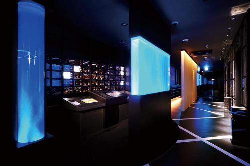a room with a table and a window with wine bottles at HOTEL O2 -Adult Only- in Hirabari