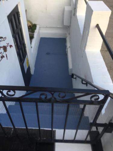 an overhead view of a stairway with a gate at The Mayfair Hotel in Great Yarmouth