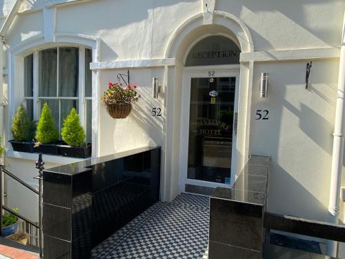 a front door of a store with a number on it at Belvedere Hotel in London