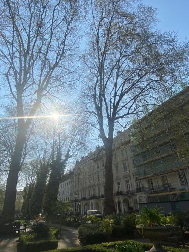 a large building with trees in front of it at Belvedere Hotel in London