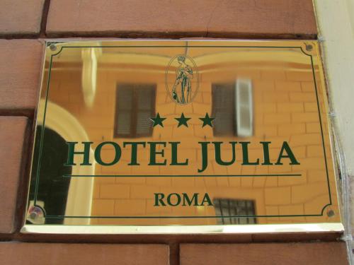 
a sign on a building at Hotel Julia in Rome
