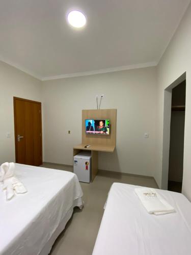 Ένα ή περισσότερα κρεβάτια σε δωμάτιο στο NOROESTE Comfort Hotel