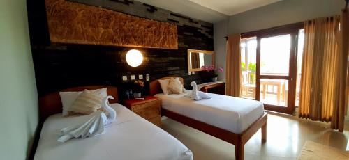 Postel nebo postele na pokoji v ubytování The point surfcamp Bali