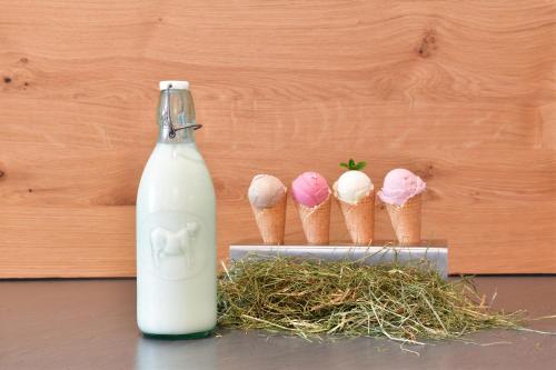 a bottle of milk next to a group of ice cream cones at Hotel Tradizio in Mittelberg