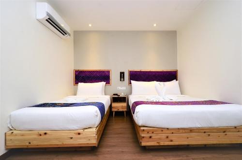 Posteľ alebo postele v izbe v ubytovaní Artisan Eco Hotel