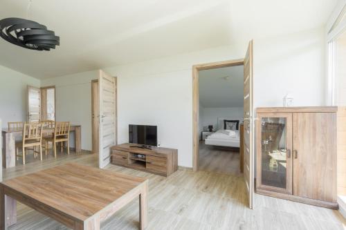 Televisyen dan/atau pusat hiburan di Praga Apartments & Restaurant Zell am See-Kaprun