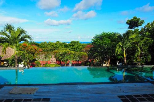 a view of a swimming pool from a resort at Villa Anjing in Nusa Dua