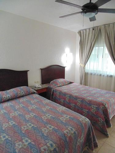 Katil atau katil-katil dalam bilik di Hotel Hacienda