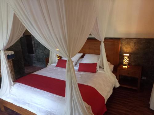 Ένα ή περισσότερα κρεβάτια σε δωμάτιο στο Villa Esa Ubud