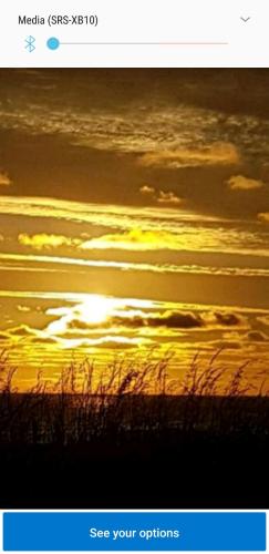 a screenshot of a sunset with the sun in the sky at Baywatch Inn in Dingle
