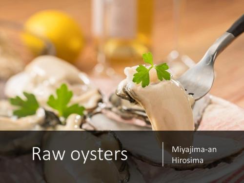 an image of a bowl of raw oysters with a spoon at Ryokan with natural hot springs and okonomiyaki Miyajima-an Hiroshima in Miyajima