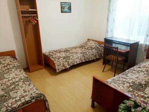 Una cama o camas en una habitación de Guesthouse on Novorossiyskaya 47