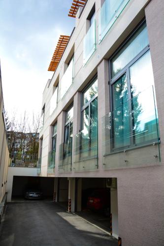 a building with a lot of windows on it at OLYMPIC 84 Apartments in Sarajevo